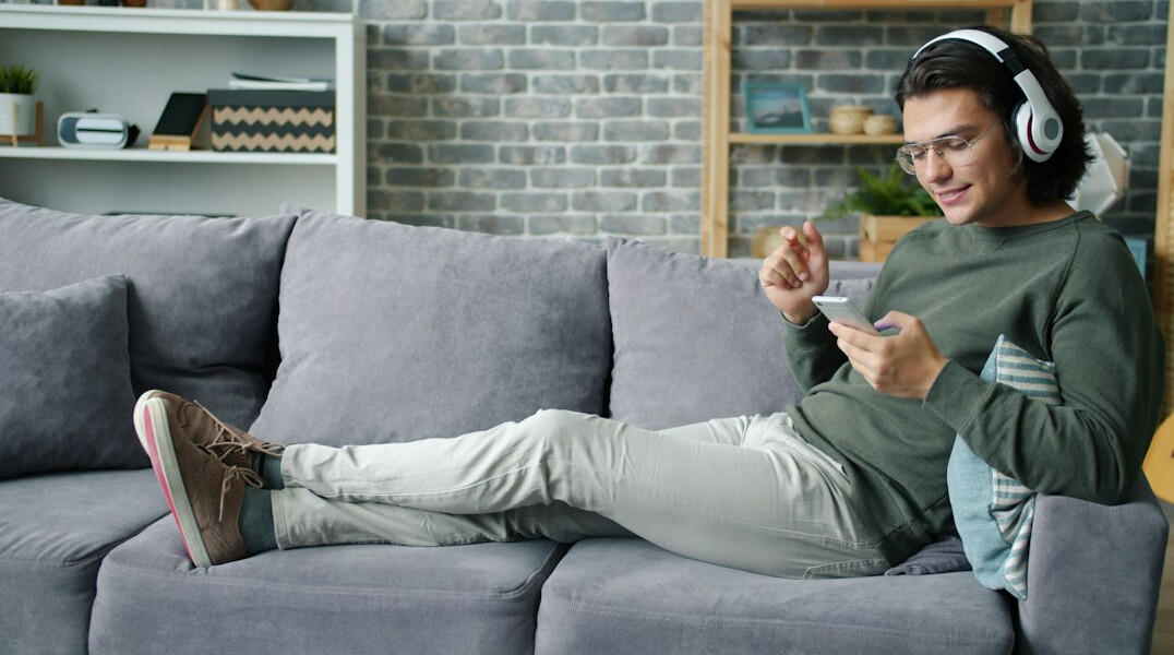 person using smartphone at home