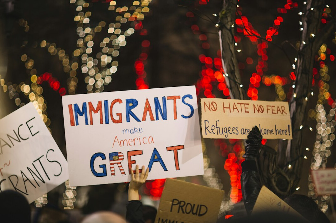 protesters holding signs